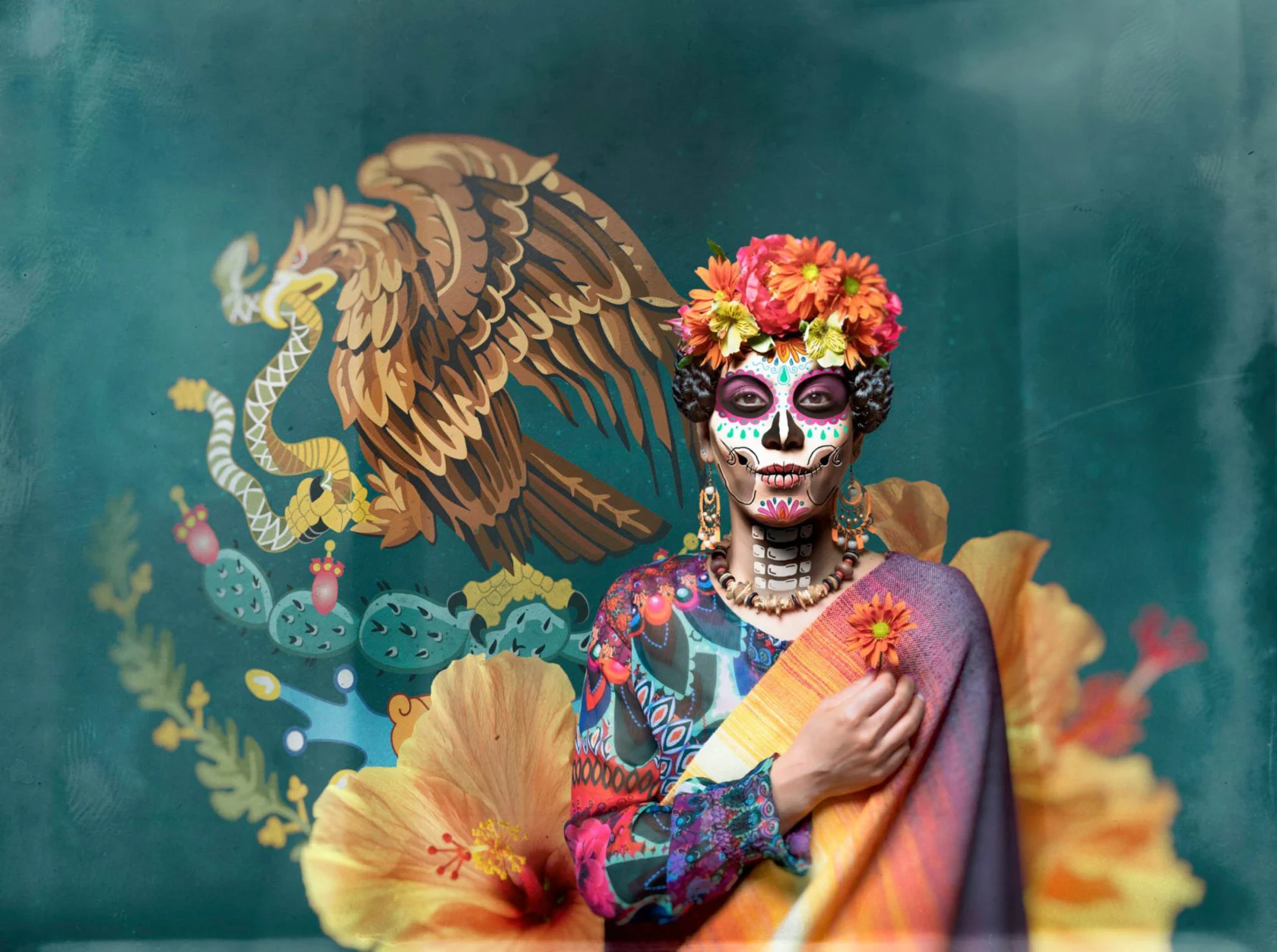 Person with Day of the Dead face paint, wearing a colorful floral headdress and attire, stands against a vibrant backdrop of an eagle and floral designs.