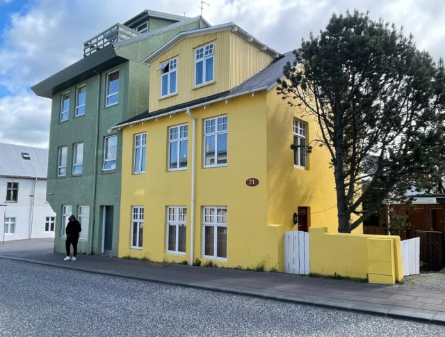 A yellow and green building in Iceland.