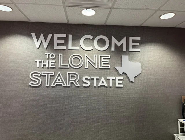 Wall sign reading "Welcome to the Lone Star State" with a silhouette of Texas.